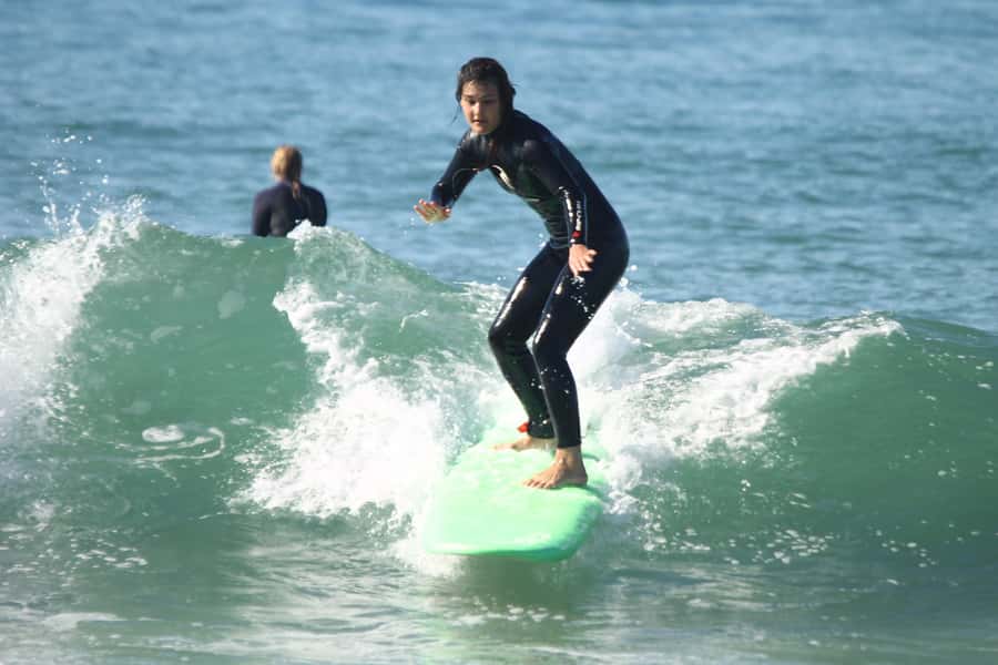 Agadir: Taghazout Beach Surf Lesson with Lunch and Transfer - Getting fitted for the wetsuit and board