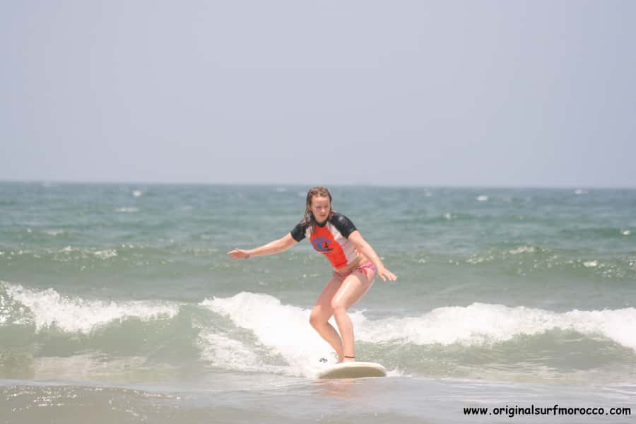 Agadir: Taghazout Beach Surf Lesson with Lunch and Transfer - Theory, warm-up, and your first attempt