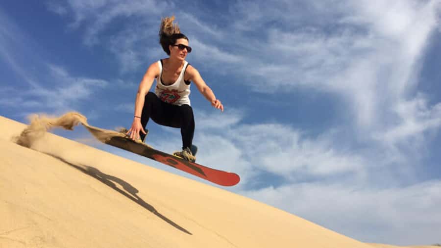 Agadir/Taghazout: Desert Sandboarding & Visit to the Canyon - Sunset over the dunes and beach