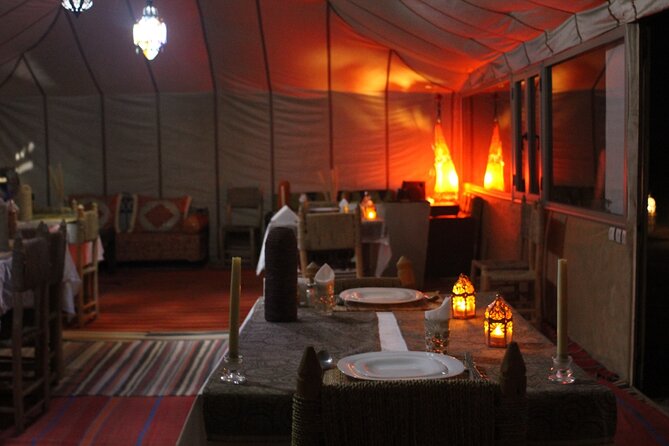 Erg Chebbi Desert Overnight in Tent with Camel Ride & Sandboard - Dinner, drums, and the desert night