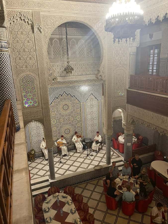 Fes : Unforgettable Dinner Show Experience with hotel pickup - Lamb tajine, chicken tajine, and couscous