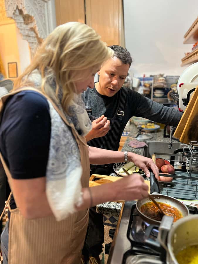 Fez: Souk Tour and Traditional Home Cooking Class - Cooking the meal, one task at a time