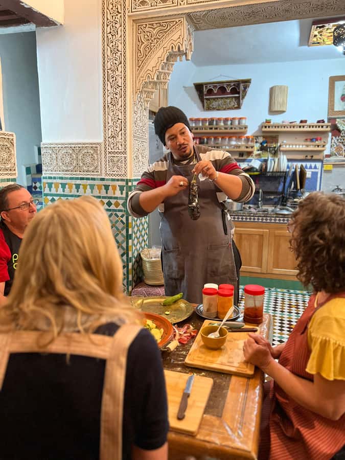Fez: Souk Tour and Traditional Home Cooking Class - Sitting down to eat the results