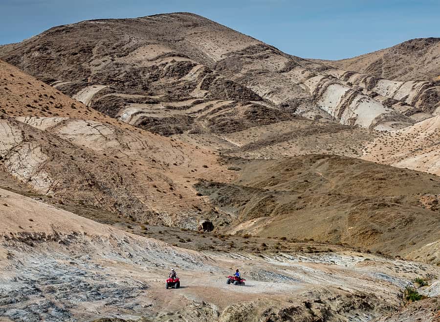 From Marrakech: Full-Day Agafay Desert Quad Adventure - Riding a Yamaha quad through the canyons