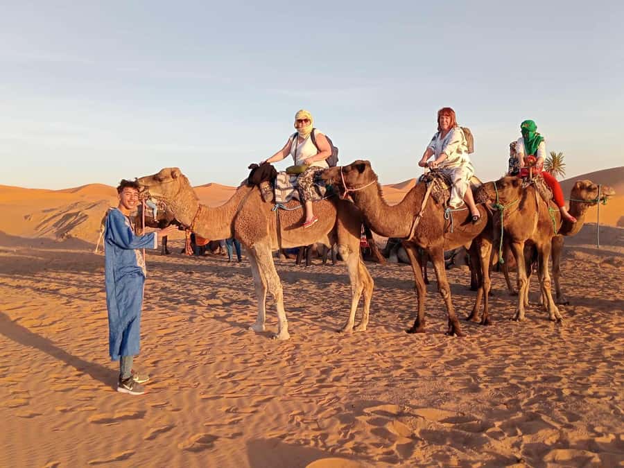 From Merzouga: Overnight Camel Trek over Erg Chebbi Dunes - A Moroccan dinner followed by drums