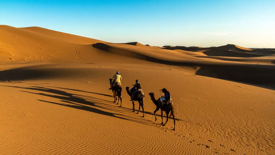 Marrakech: 3-Day Merzouga and Sahara Desert Tour - Camel riding into Erg Chebbi at sunset