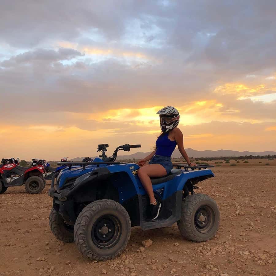 Marrakech: Desert and Palm Grove Sunset Quad Tour with Tea - Riding through palms, hills, and rocky desert