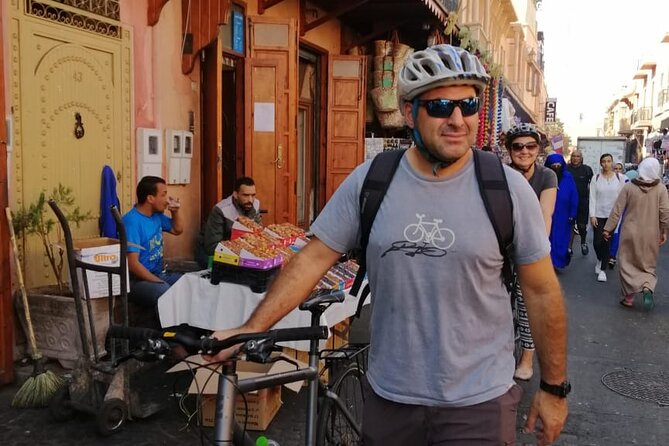 Marrakech Food Tasting Tour by Bike - Passing the royal palace area by bicycle
