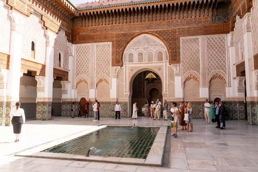 Marrakech: Madrassa Ben Youssef, Secret Garden & Medina Tour - The Medina walk and Djemaa El Fna finale