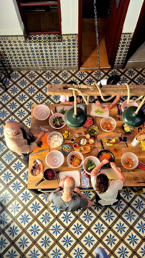 Marrakech: Moroccan Cooking Class with Amazing Local Chef! - Building your tagine around the table