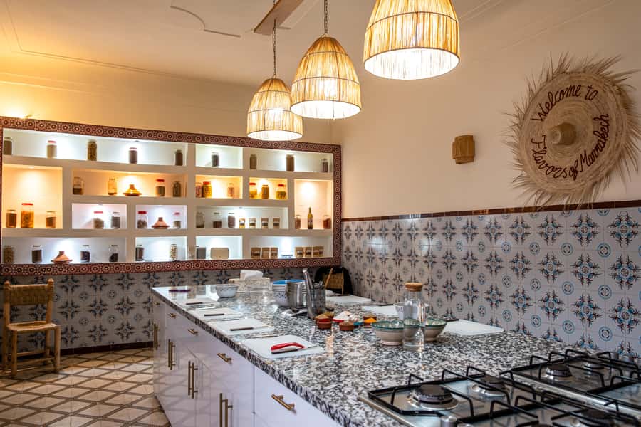 Marrakech: Moroccan Cooking Class with Market Visit and Meal - Returning to the Bright, Well-Equipped Kitchen