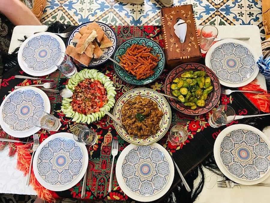 Marrakech: Traditional Moroccan Cooking Class & Market Visit - Cooking with local women and learning through translation