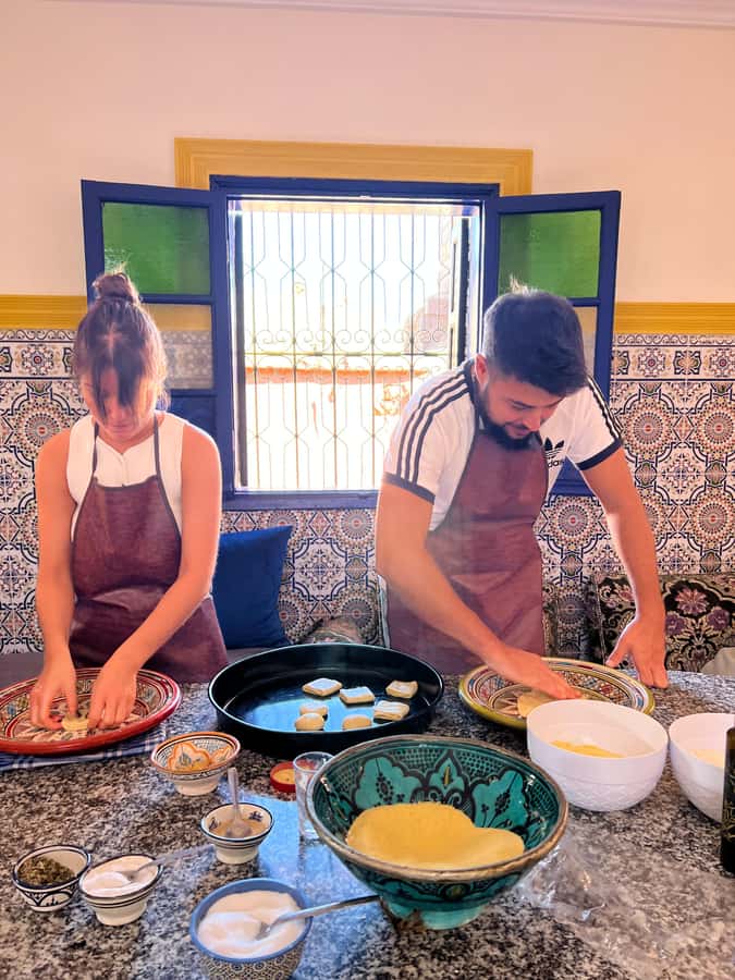 Marrakech: Traditional Moroccan Crepes & Bread Cooking Class - Getting your hands into the dough