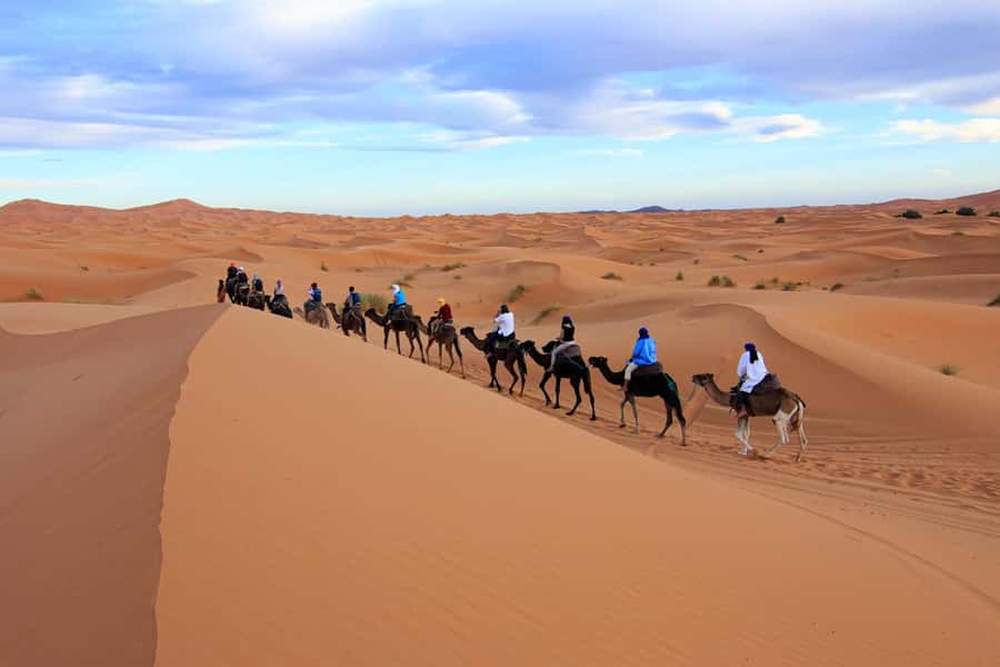 Merzouga: 1-Night in Desert Camp With Dinner & camel ride - The sunset camel ride and sandboarding stop