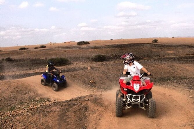 Quad bike ride palm grove Desert of Marrakech mountain bike - Riding beside Berber villages